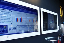 Posters were presented as a non-stop  presentation on three screens.
